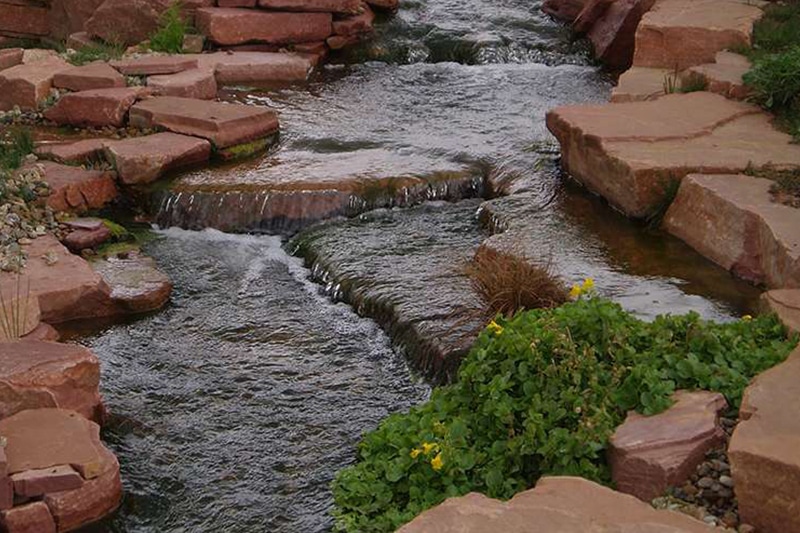 red rocks around a stream