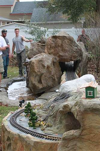boulders water and train track J&S Landscape Boulder
