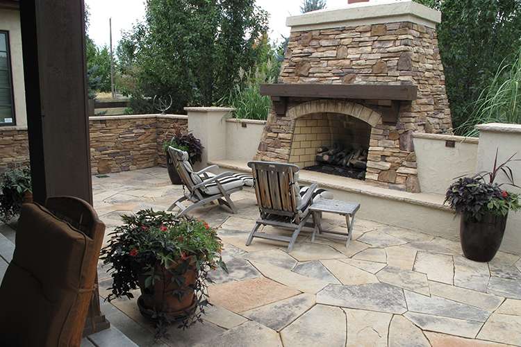 flagstone patio and fireplace J&S Landscape Boulder