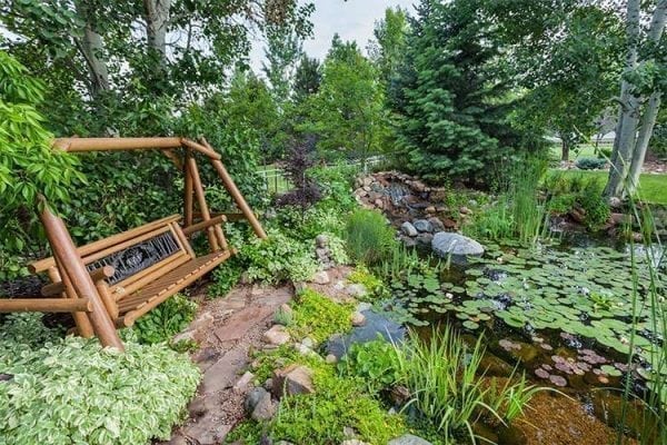 swing bench and pond J&S Landscape Boulder